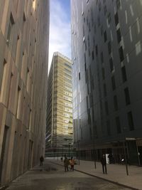 Street amidst buildings in city against sky