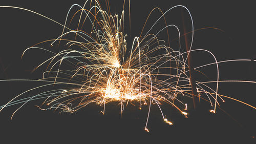 Close-up of firework display at night