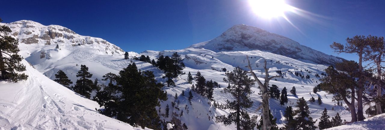 snow, cold temperature, winter, mountain, season, snowcapped mountain, mountain range, tranquil scene, tranquility, beauty in nature, weather, scenics, covering, landscape, nature, sunlight, blue, non-urban scene, sun, frozen