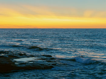 Scenic view of sea against sky during sunset