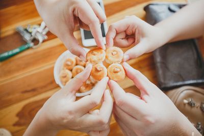 High angle view of woman holding cookies