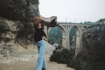 Woman standing on bridge