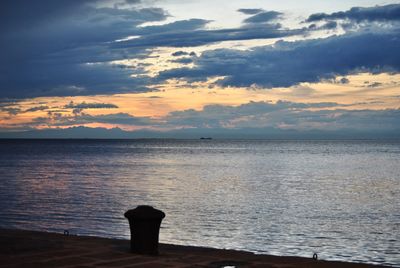 Scenic view of sea against sky at sunset