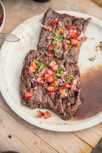 High angle view of steak in bowl on table