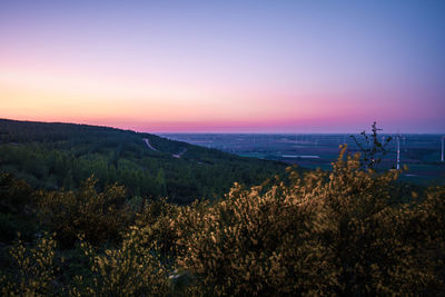 Scenic view of landscape against sky during sunset