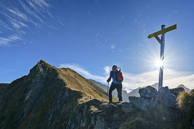 Austria, tyrol, female hiker following aschaffenburger hohenweg trail in zillertal alps
