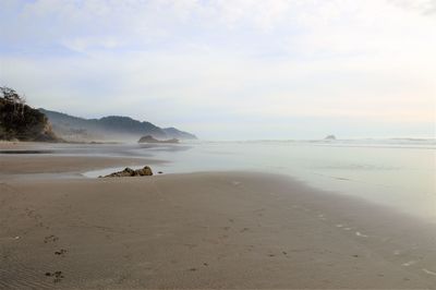 Scenic view of beach against sky