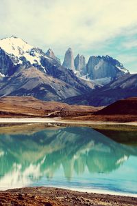 Scenic view of mountains against cloudy sky