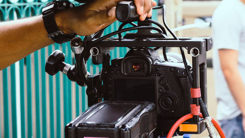 Close-up of man holding camera