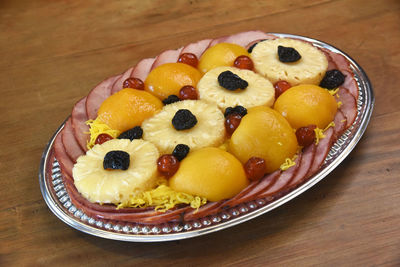 High angle view of fruits in plate on table