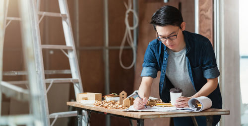 Young man working on table