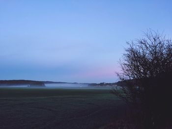 Scenic view of land against clear blue sky