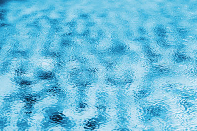 Full frame shot of blue water in swimming pool