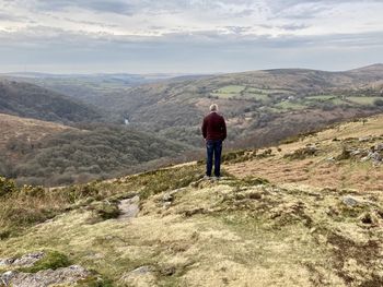 Rear view of man walking on mountain