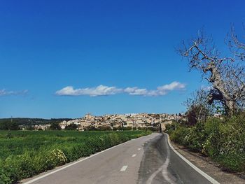 Empty road along landscape