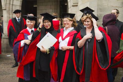 Group of people standing against blurred background