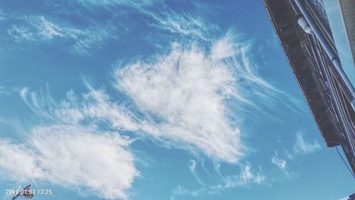 Low angle view of building against blue sky