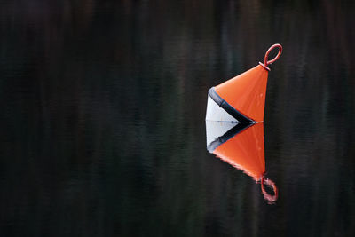 Red buoy in lake
