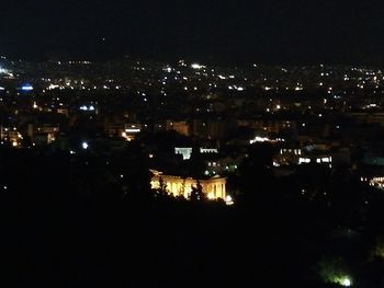 High angle view of illuminated buildings in city at night