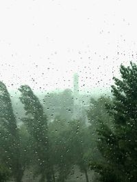 Full frame shot of wet glass window during rainy season