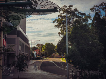 Street amidst buildings against sky