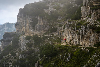 Panoramic view of people on rock formations