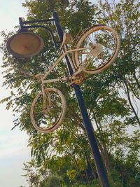 Low angle view of bicycle wheel against sky