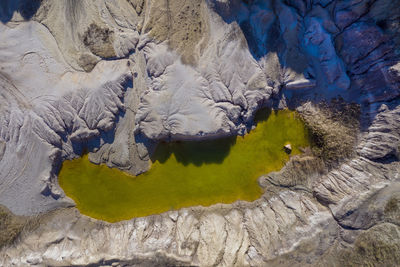 Aerial view of open pit mine lake