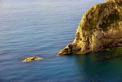 High angle view of rock formation in sea