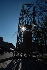 Low angle view of amusement park against sky