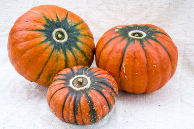 Close-up of pumpkin against orange background