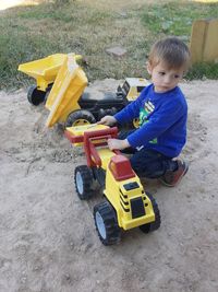 Boy playing with toy car