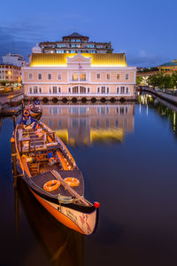 Illuminated building at waterfront