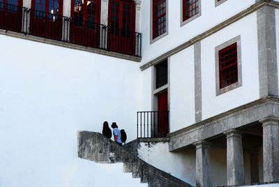 People walking on steps in building