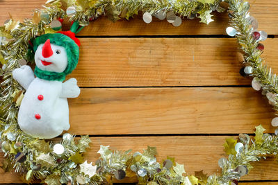 Close-up of christmas decorations on wooden table
