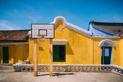 Yellow building against blue sky