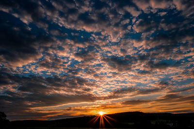 Sun shining through clouds