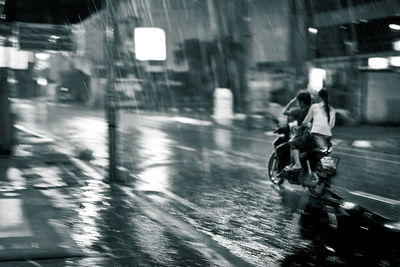 Man riding bicycle on city street