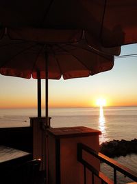 Scenic view of calm sea at sunset