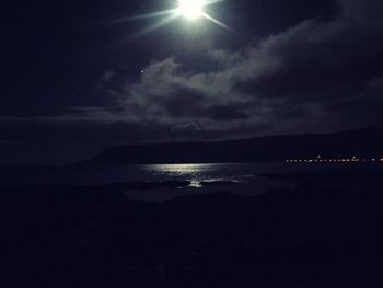 Scenic view of sea against sky at night