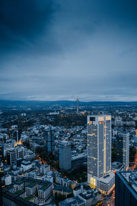 High angle view of modern buildings in city against sky