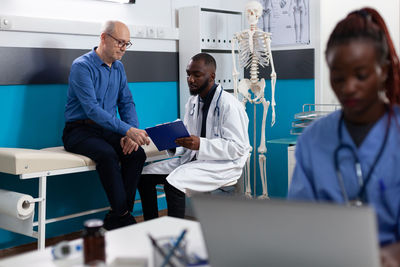 Doctor discussing with patient at clinic