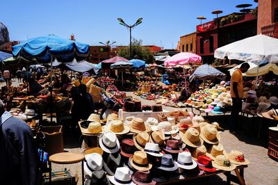 People at market stall in city