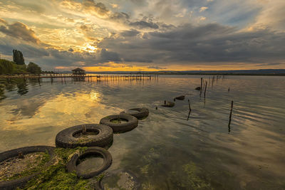 Scenic view of lake against sky during sunset