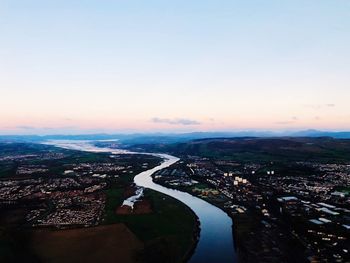 High angle view of city against sky during sunset
