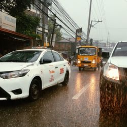 Cars on road in rainy season