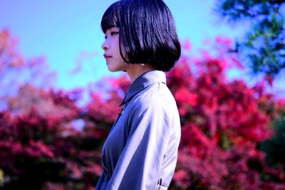 Side view of woman with short hair looking away