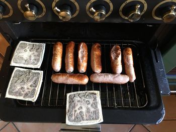 High angle view of meat on barbecue grill