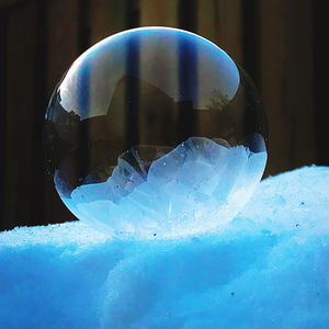 Close-up of crystal ball on snow