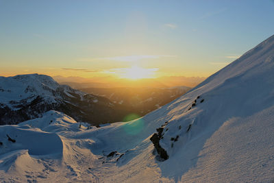 Scenic view of mountains against sky during sunset